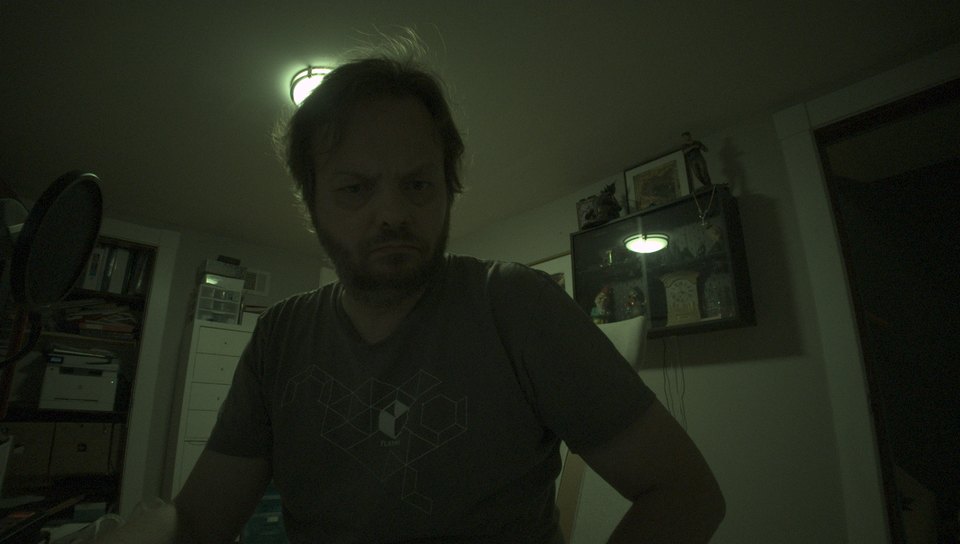 Stock camera output: flat, desaturated, dark corners